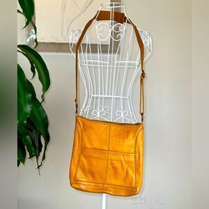 Woman yellow leather shoulder purse by The Sak Originals